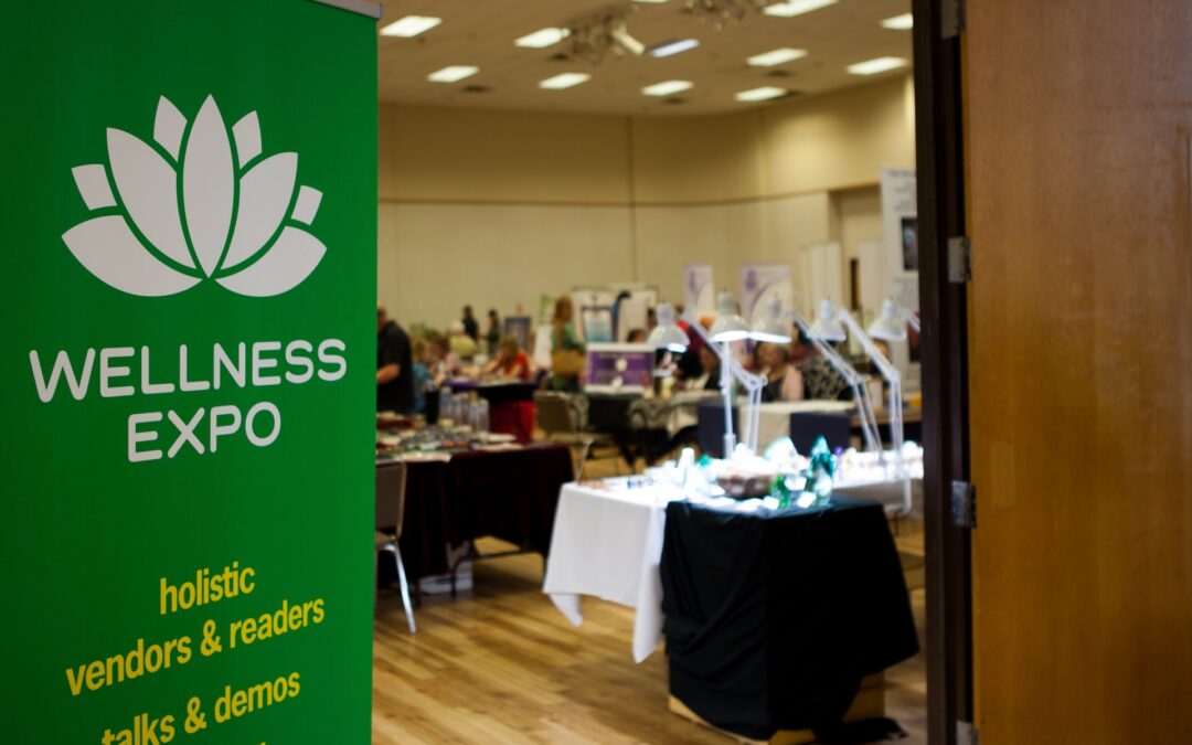 A Wellness Expo sign at the entrance to the exhibit hall.