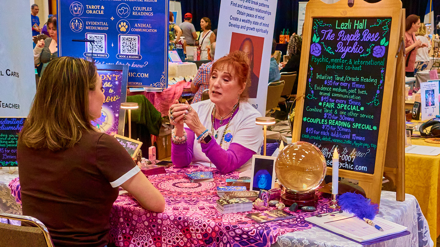 One-to-one conversation at a colorful booth at the Grapevine Wellness Expo, October 10–11, 2026.