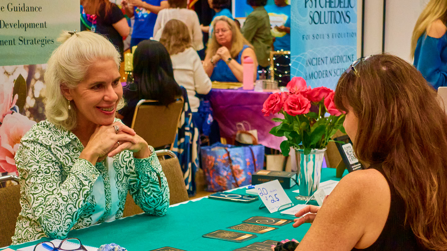 Small group sharing a discovery at the Grapevine Wellness Expo, October 10–11, 2026.