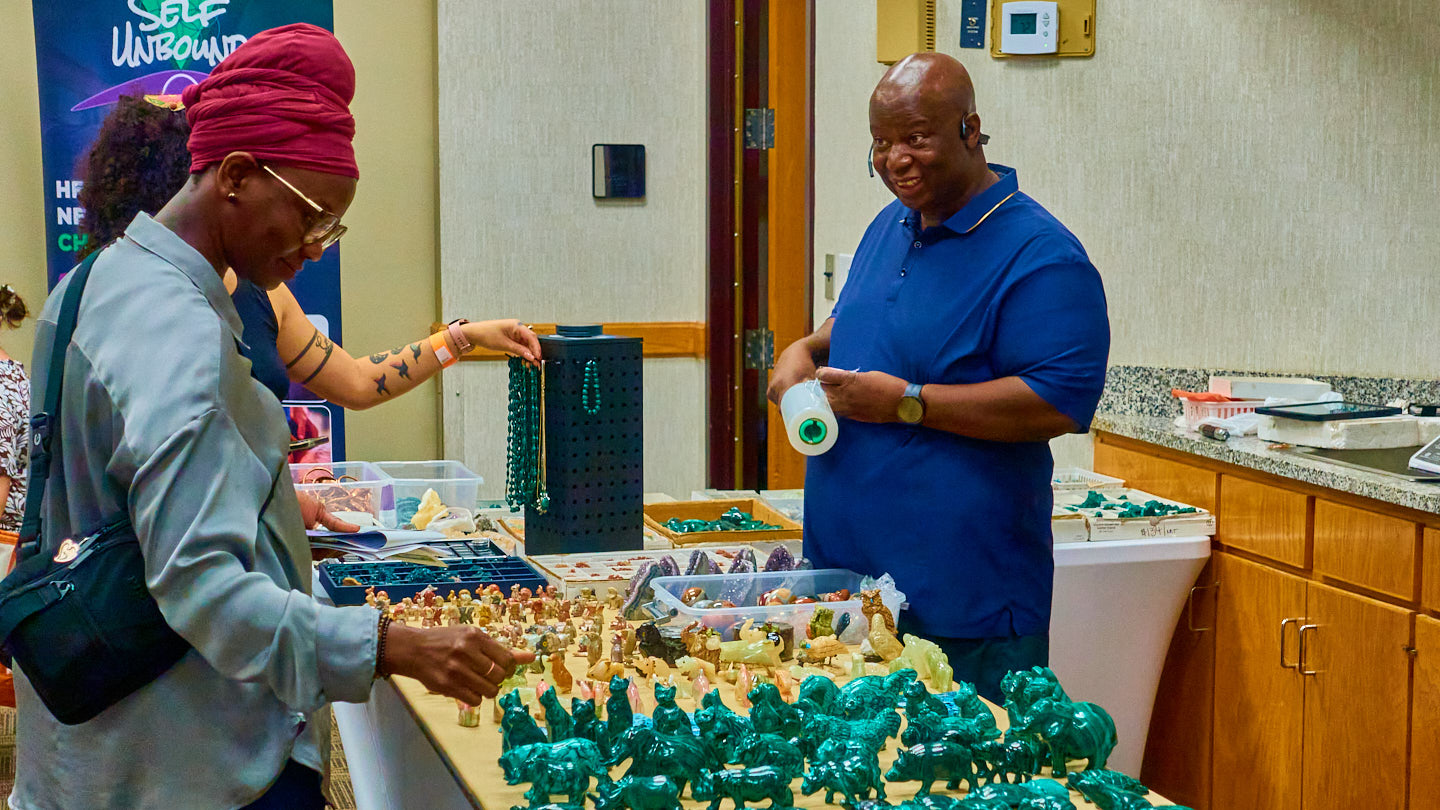 Vendor interaction at a market display at the Grapevine Wellness Expo, October 10–11, 2026.