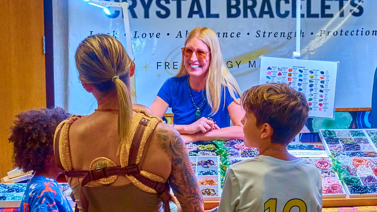 Family browsing a colorful booth at the Grapevine Wellness Expo, October 10–11, 2026.