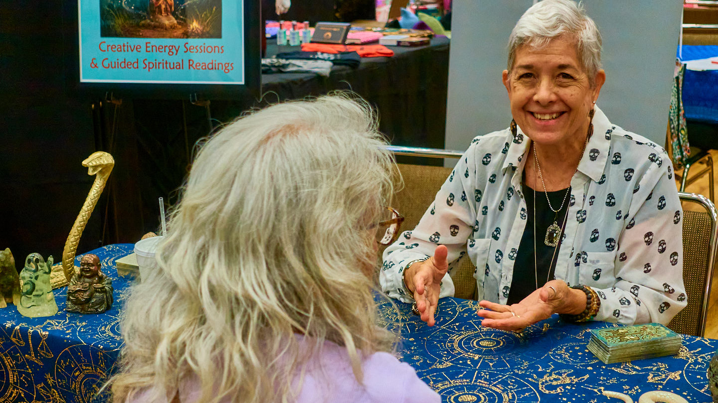 Friendly vendor portrait at an expo table at the Grapevine Wellness Expo, October 10–11, 2026.